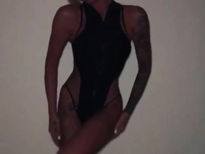 tattooed slim lady dancing