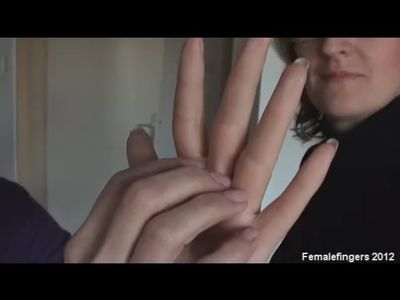 two matures women compare hands