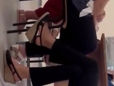 Teacher feet dangling in class