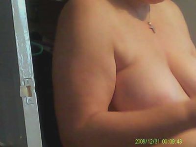 Mature wife spied topless after shower