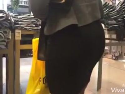 Black lady with tight dress and nice tits in mall