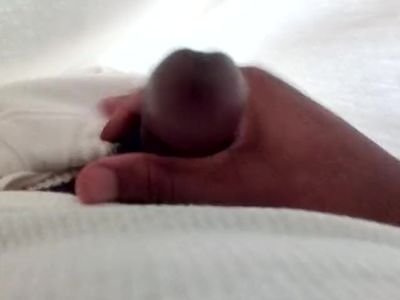 Another day in prison.... Hiding under my covers stroking cum from my dick.
