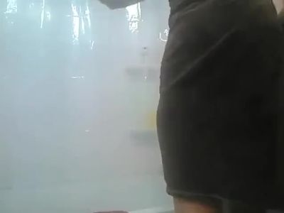 Pregnant wife drying off after shower