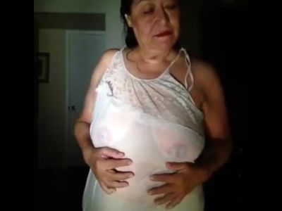 mature woman dancing in her wet nightgown