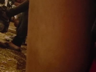 Mature womans feet at restaurant