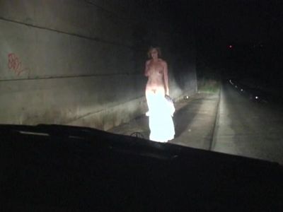 Naked on the road at night