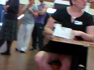 spreading her legs at work